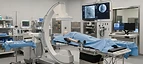 Mobile C-Arm — C-arm fluoroscopy machine in an interventional procedure room