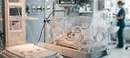 Neonatal Incubator — Neonatal incubator and radiant warmer with neonatal monitor in a neonatal intensive care unit