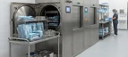 Ultrasonic Cleaner — Steam autoclave sterilisers and instrument racks in a central sterile services department