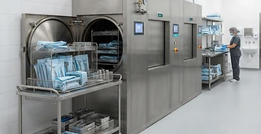 Sterile Storage Cabinet — Steam autoclave sterilisers and instrument racks in a central sterile services department