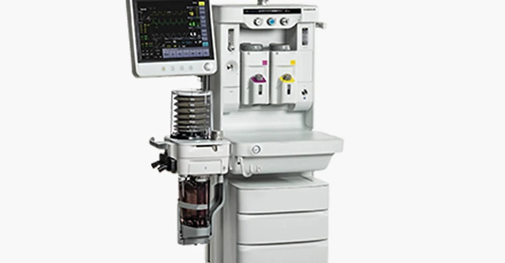 White dual-display anaesthesia workstation with patient monitor, articulating touchscreen, dual vaporizers, bellows breathing system and drawer cabinet on castor base