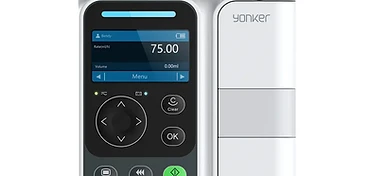 Yonker volumetric infusion pump with LCD flow-rate and delivered-volume display, navigation pad and colour-coded start, bolus and stop keypad on a white pole-mountable chassis
