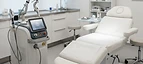 Microdermabrasion System — Medical laser device and examination bed in a dermatology and aesthetics clinic