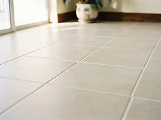 Tile floor with clean, even grout after professional restoration