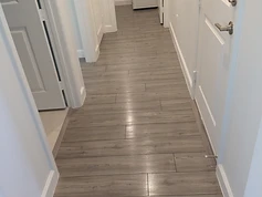 Grey LVP hallway floor in a Lennar Homes residence protected with Rexpro coating