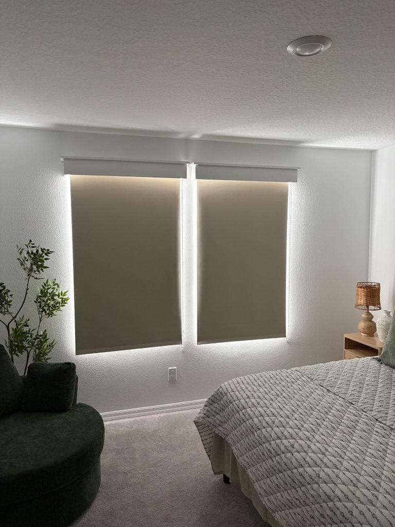 After: bedroom fitted with custom taupe roller shades