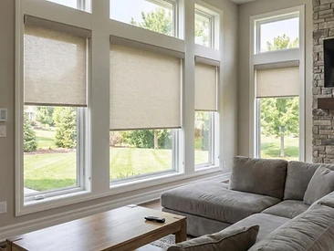 Motorized roller shades covering a wide sliding glass wall