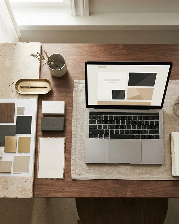 Stone + Grain Studio creative workspace featuring website design, branding materials and marketing collateral.