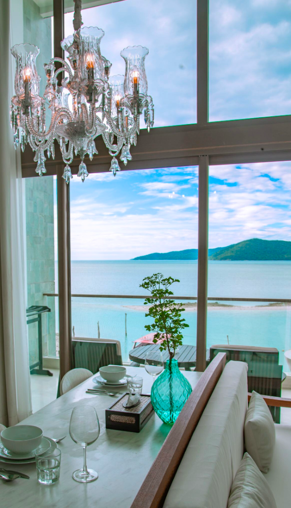 Suite dining area overlooking the tropical bay