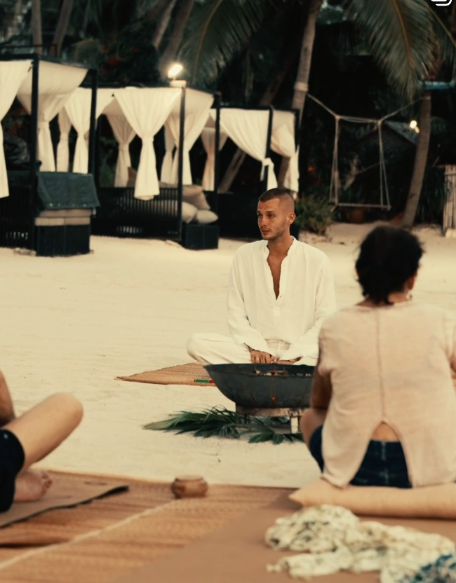Beachfront meditation and wellness session with cabanas