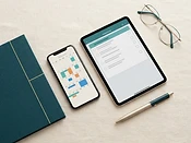 A phone and tablet side by side showing a simple calendar and a document checklist — both tools, one organized place.