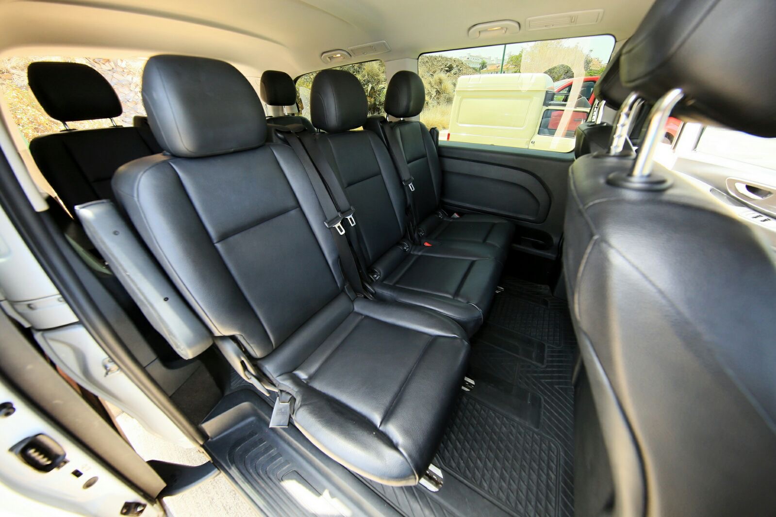Middle row — black leather passenger seats