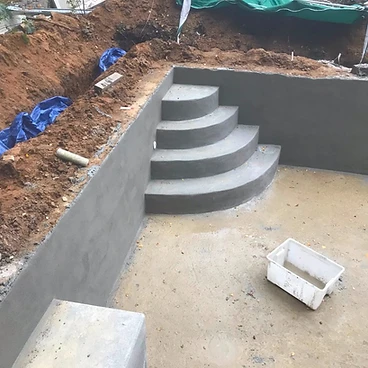 Concrete pool steps with blockwork and rendered tread faces in Sunbury-on-Thames