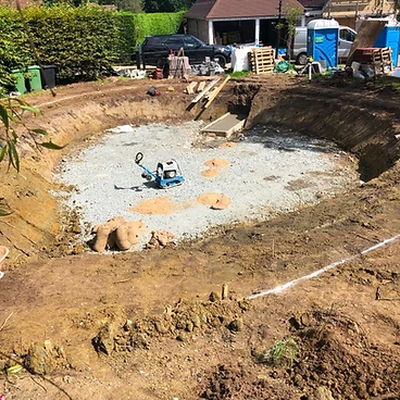 Blinding layer of compacted hardcore in the pool excavation base in Sunbury-on-Thames