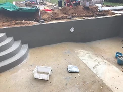 Rendered concrete pool steps and walls ready for liner in Surrey