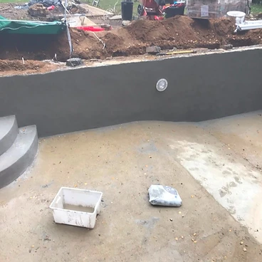 Rendered concrete pool steps and walls ready for liner in Sunbury-on-Thames