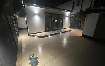 Outdoor space transformed with paving and landscaping in a Surrey garden