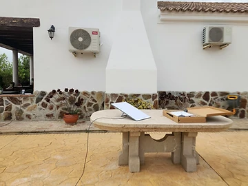Starlink dish set up on an outdoor patio table during installation