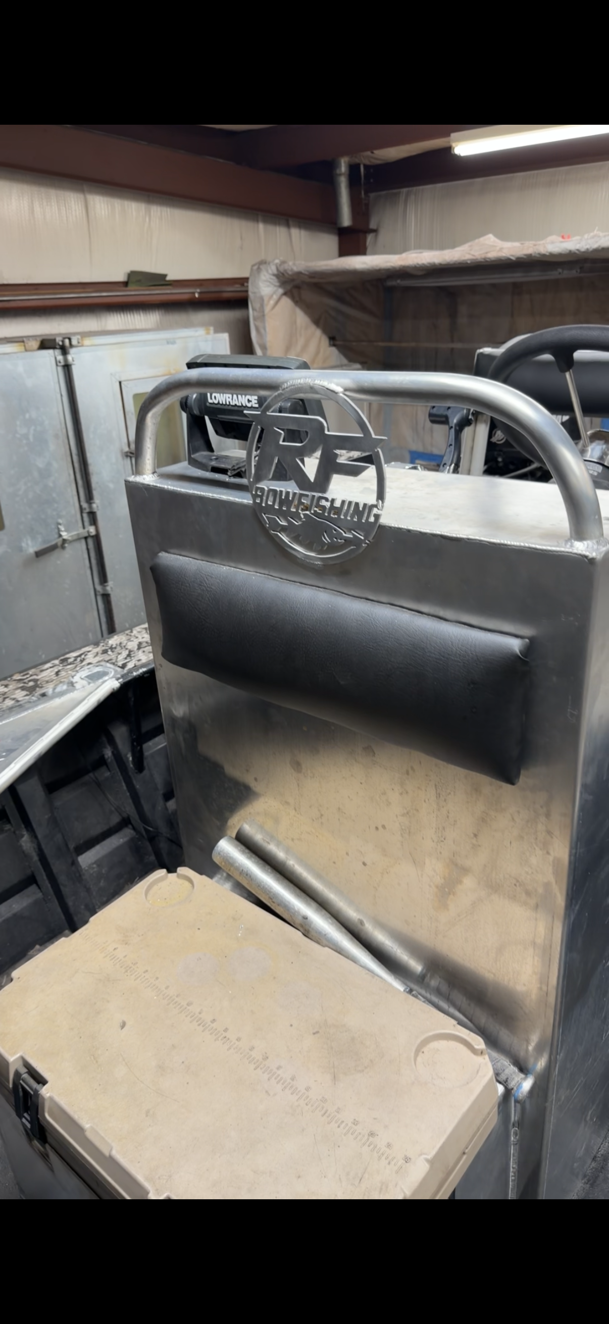 Custom RF Bowfishing boat console with plasma-cut logo plate fabricated by Rabideau Fabrication
