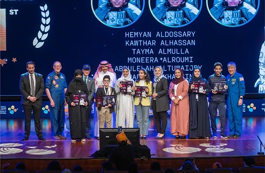 Award ceremony on stage with certificates