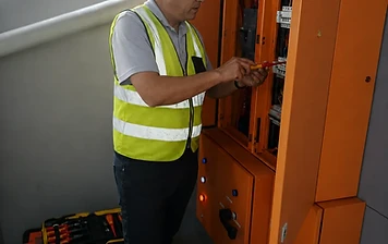 Our engineer wiring a control cabinet on site.