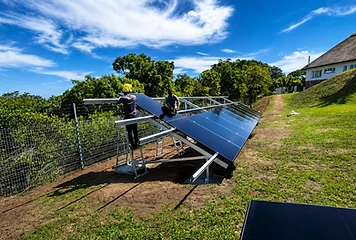 Ground-mounted solar array installation by our team.