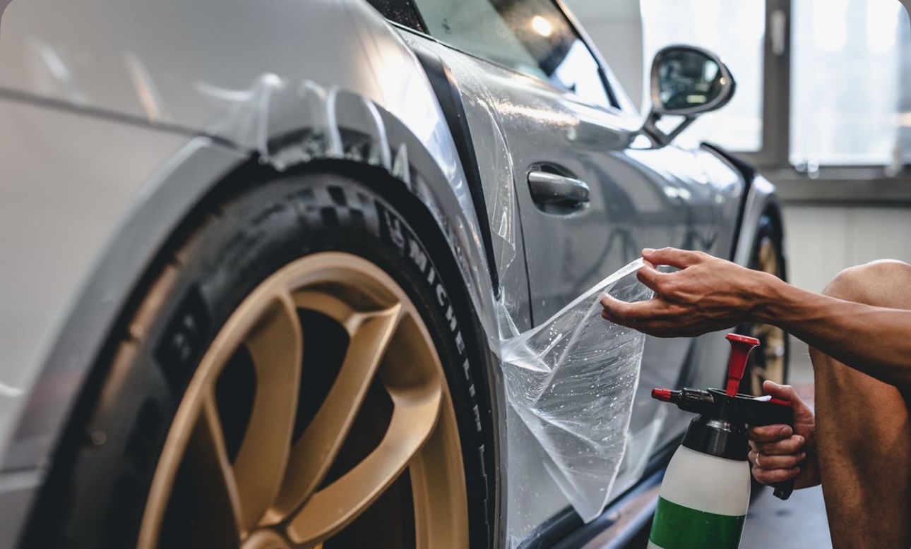 Studio Veil customizing a dealership vehicle with PPF and tint in Kansas City