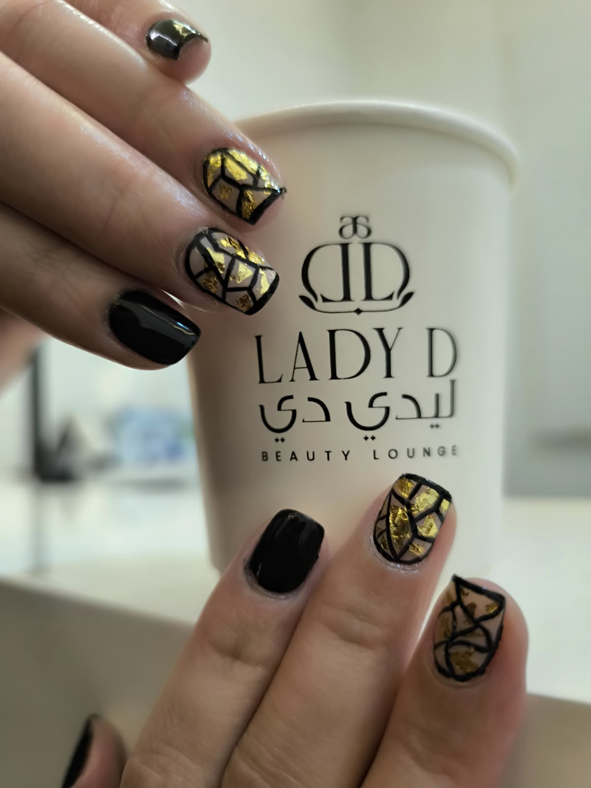 black and gold geometric nail art by Lady D Beauty Lounge