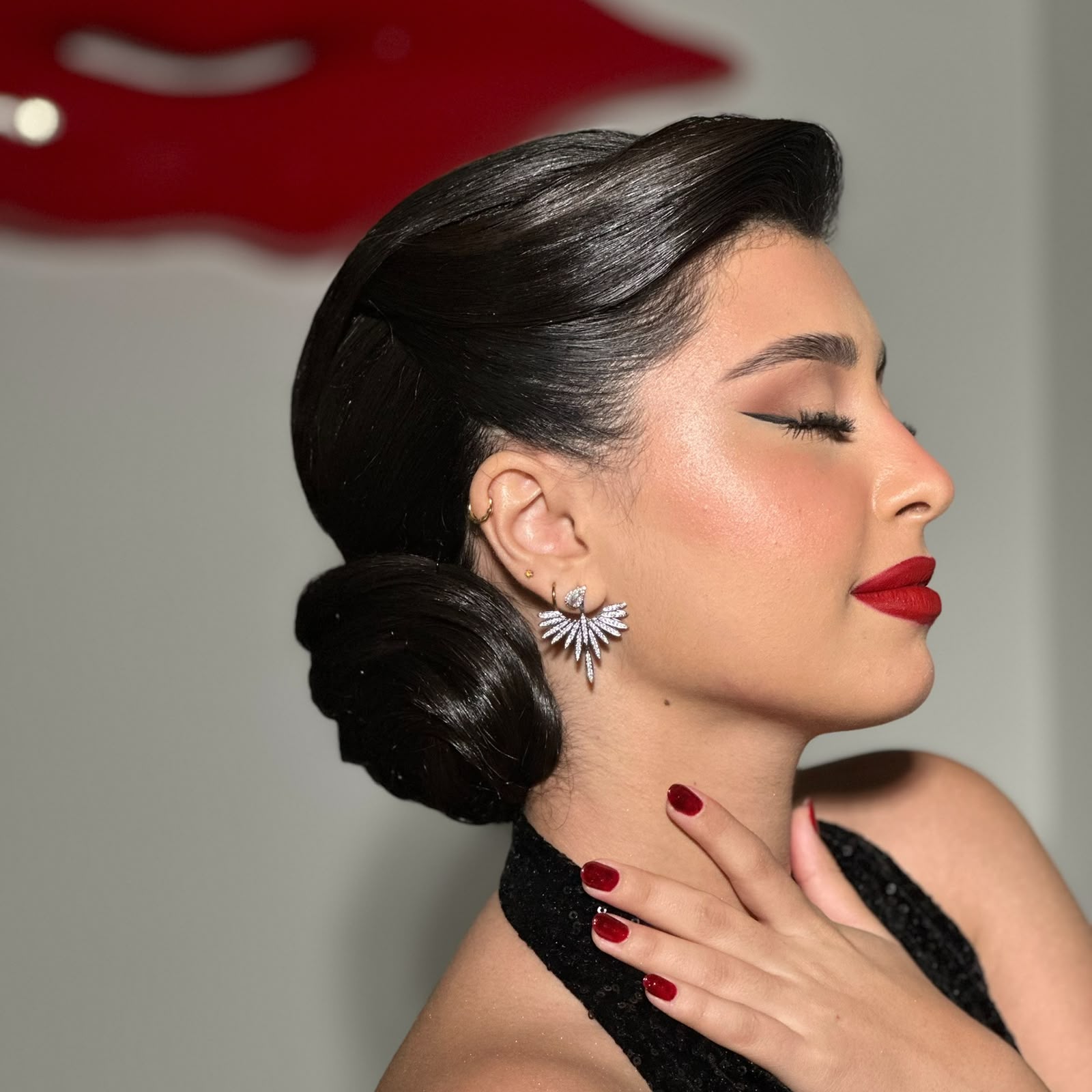 Lady D Beauty Lounge — classic red lip sleek bun profile
