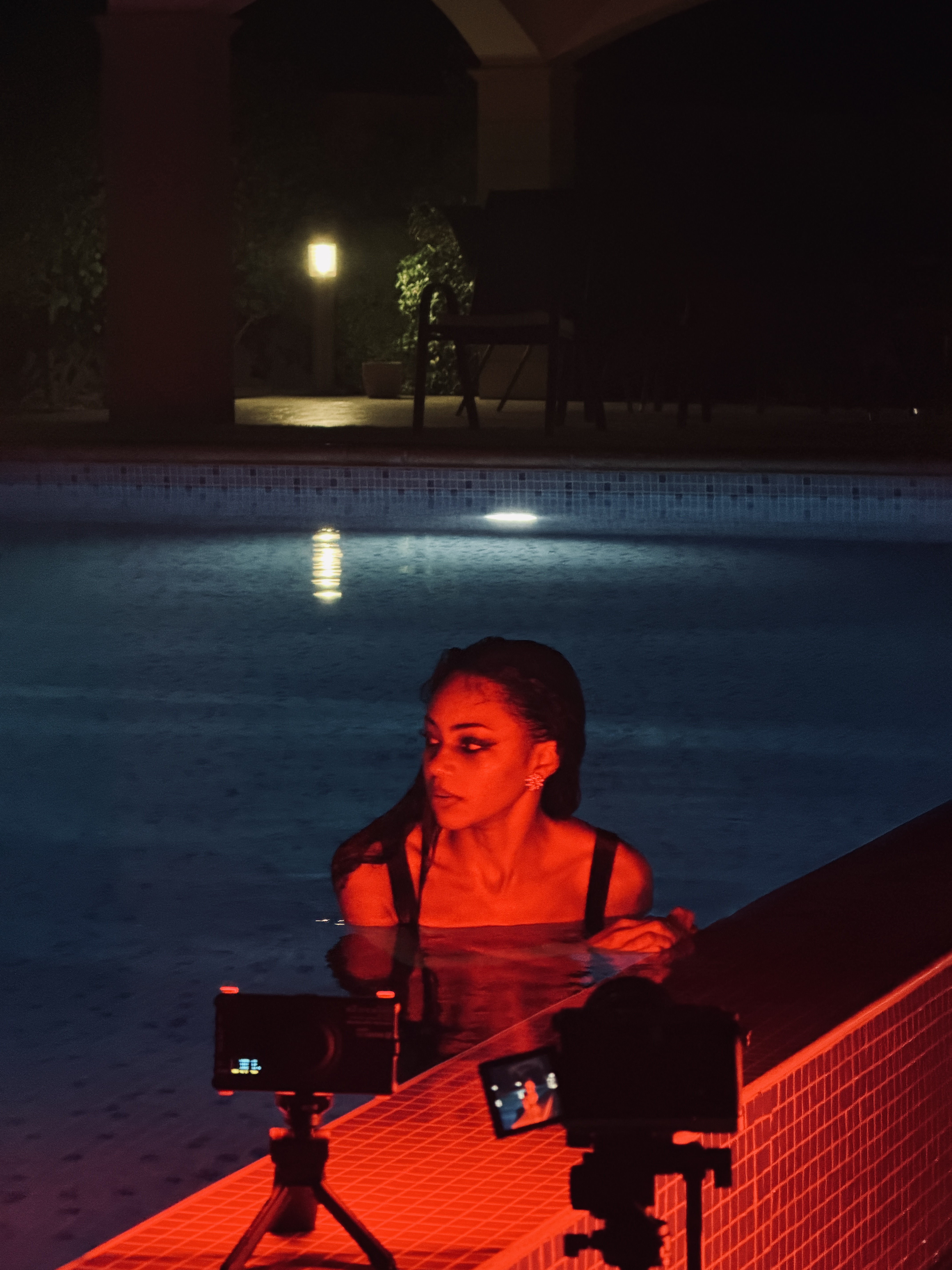 Behind the scenes of a night pool self-portrait shoot