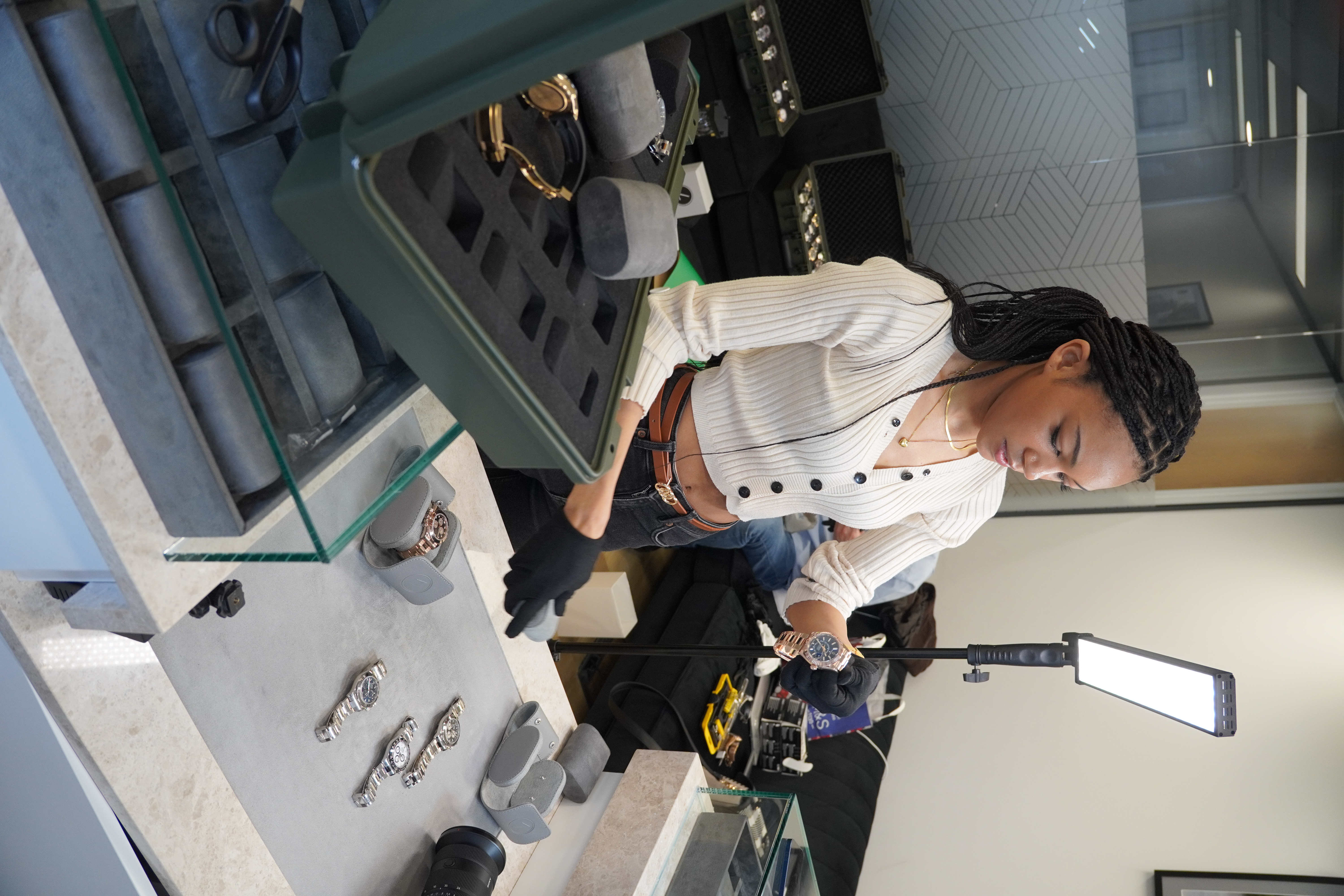 Christiana handling a luxury watch during the Luxury Times shoot