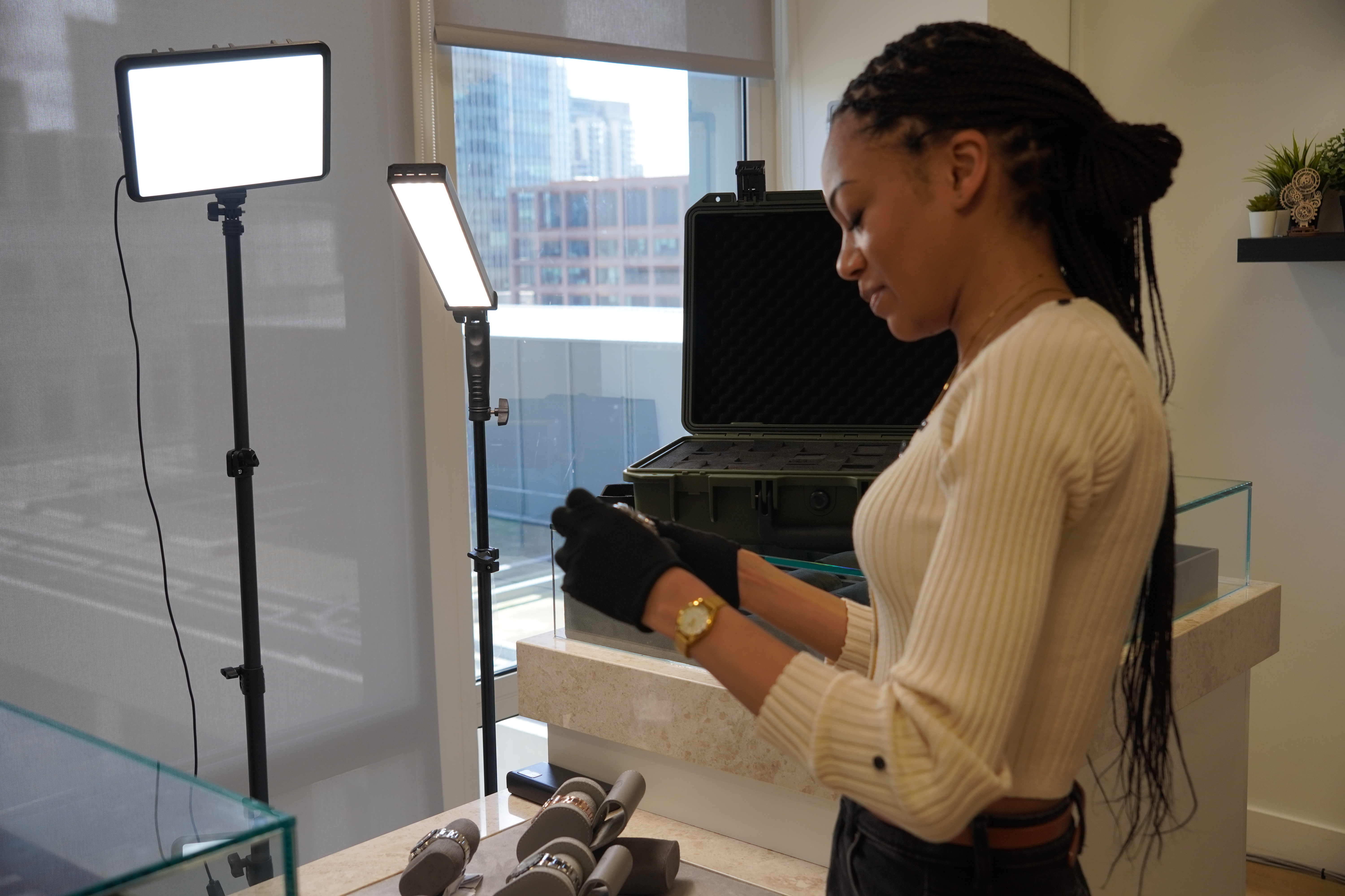 Christiana preparing watches on set