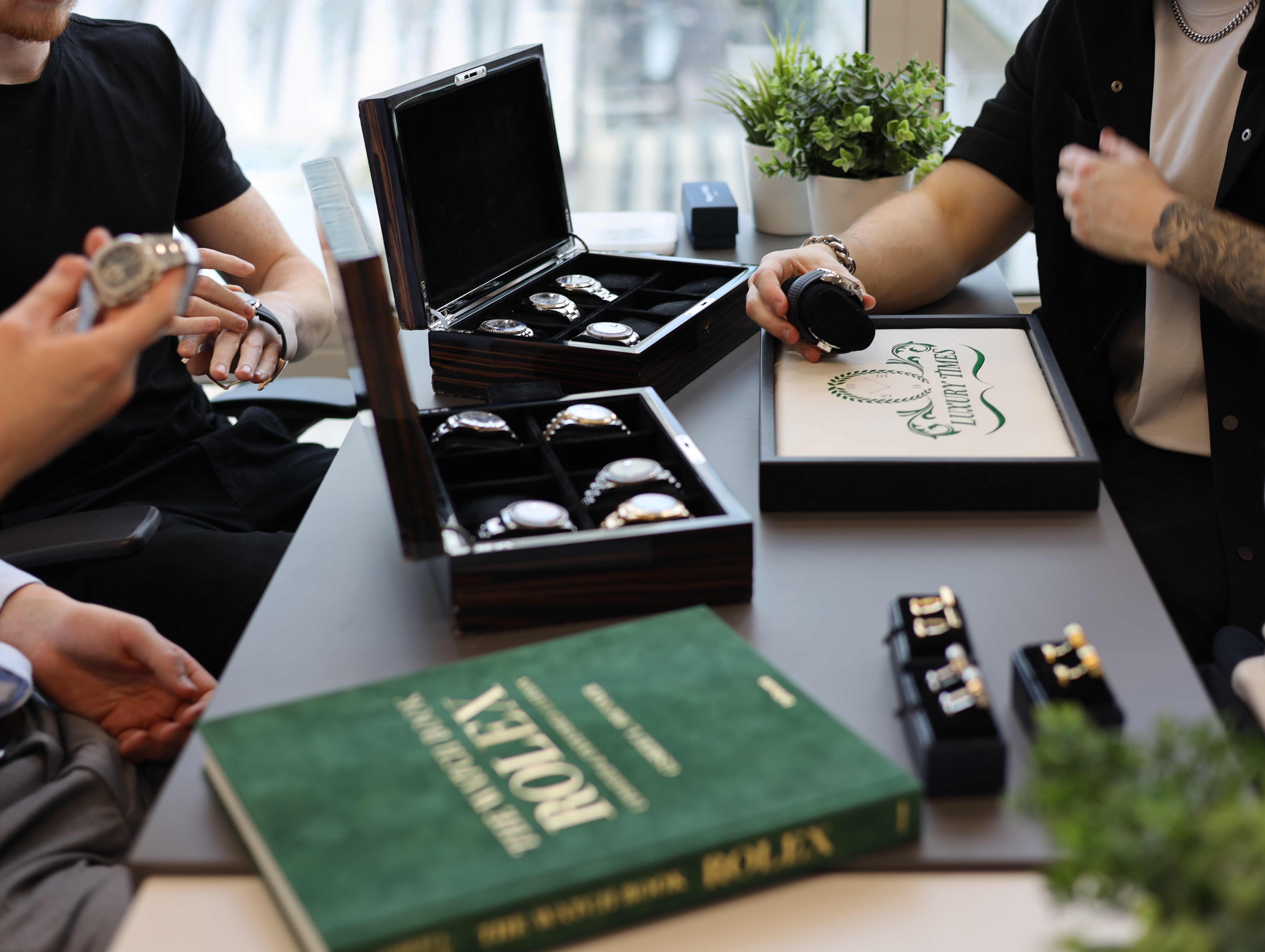 Luxury watches displayed in wooden cases