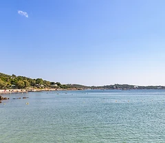 Aerial view of a beach and turquoise sea in Vouliagmeni on the Athens Riviera