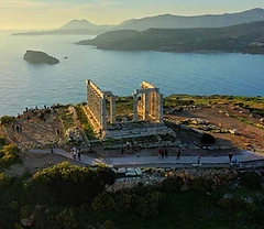 The Temple of Poseidon at Cape Sounion above the Aegean Sea near sunset