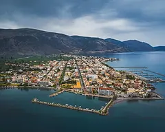 Aerial view of Itea on the Corinthian Gulf, with its harbours, town grid, olive groves and surrounding mountains