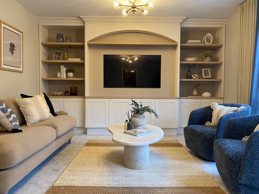Arched Recess Media Wall — Fluted cabinetry with oak shelving