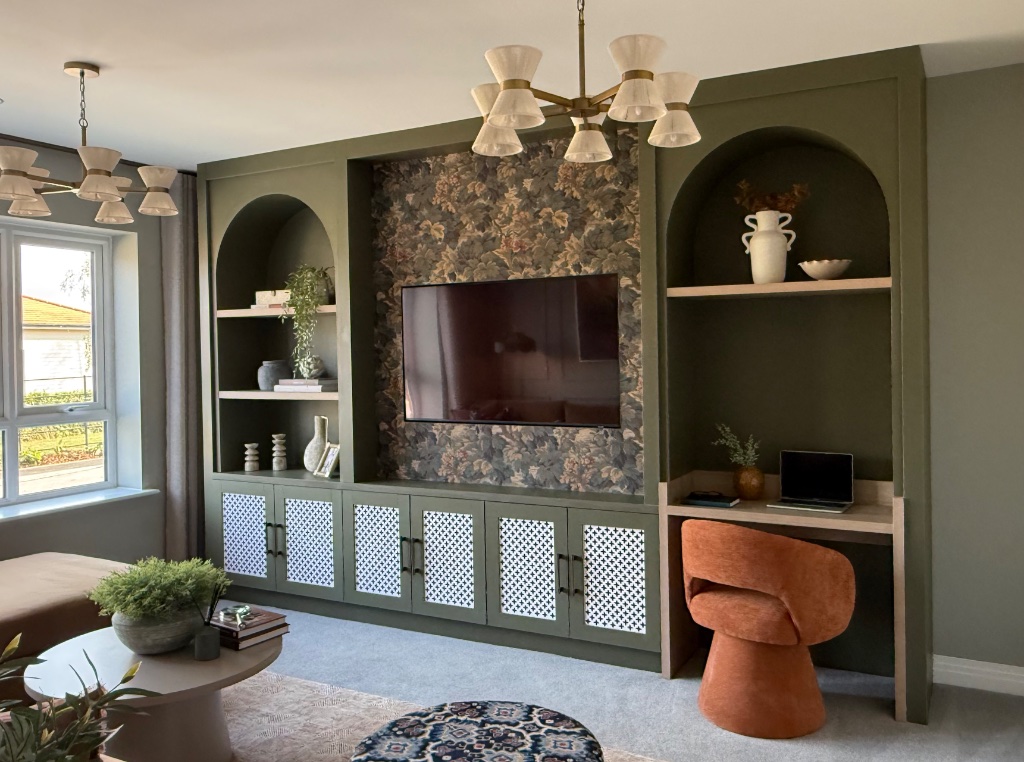 Bespoke arched olive-green media wall with integrated desk area