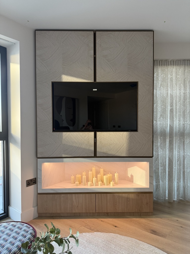 Hearth Media Wall — Marble recess with candle display & oak cabinets