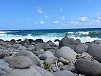 Rocky Azores shoreline with a calm blue sea