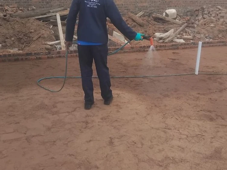 WAZ technician applying professional pest control treatment on-site