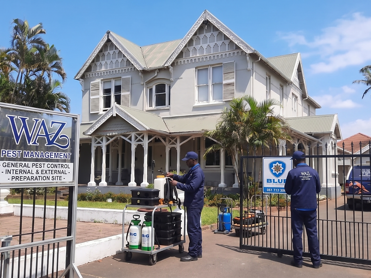 WAZ Pest Management technicians arriving at a property with professional equipment