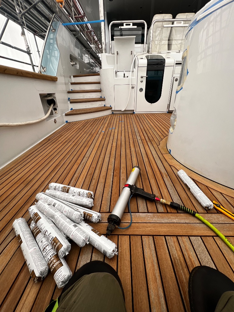Teak deck recaulking with SIS 440 sealant and caulking gun