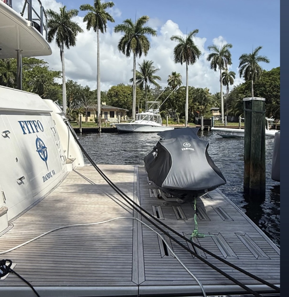 Weathered, gray, sun-damaged yacht teak deck before restoration