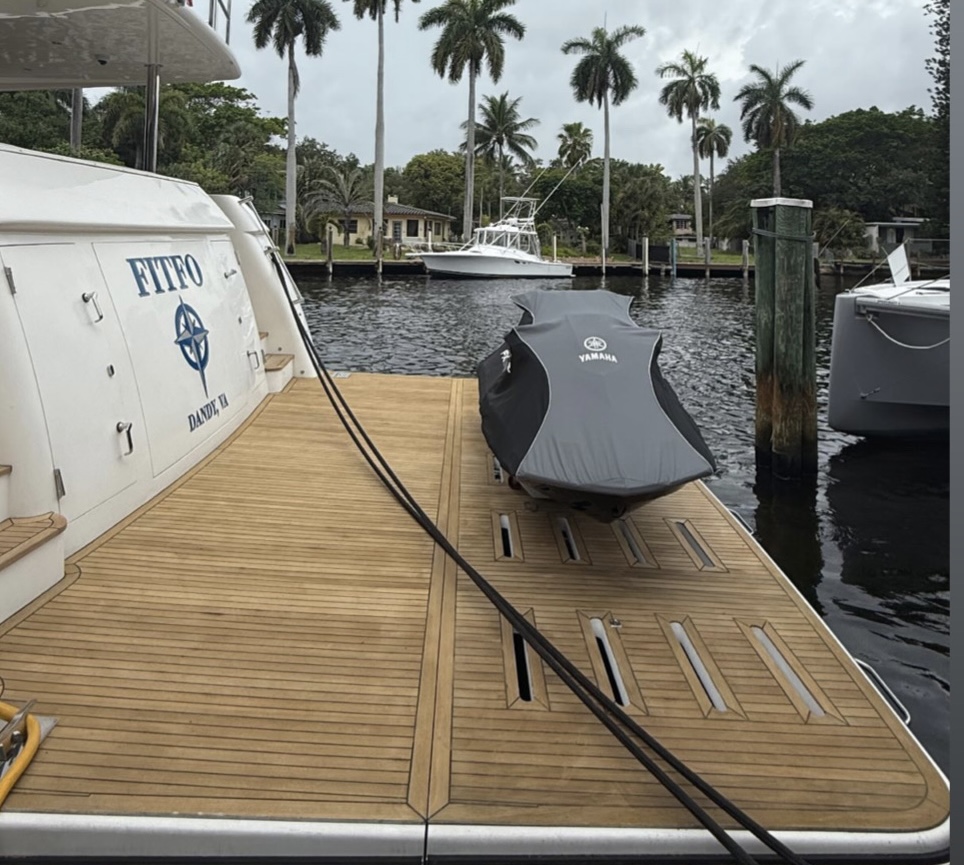 Freshly sanded and recaulked golden teak deck restored by Teak Techs