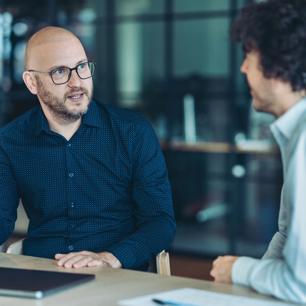 Parole or probation officer meeting with a client