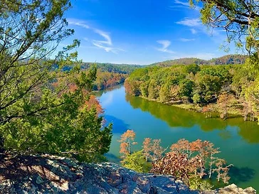 Broken Bow Lake with crystal clear emerald water surrounded by pine forest