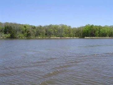 Pine Creek State Park — quiet forested lake with pine trees and fishing dock