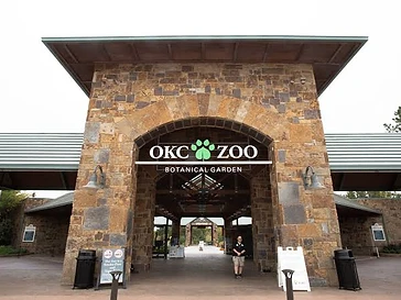 Oklahoma City Zoo — entrance gate and expansive grounds with lush landscaping