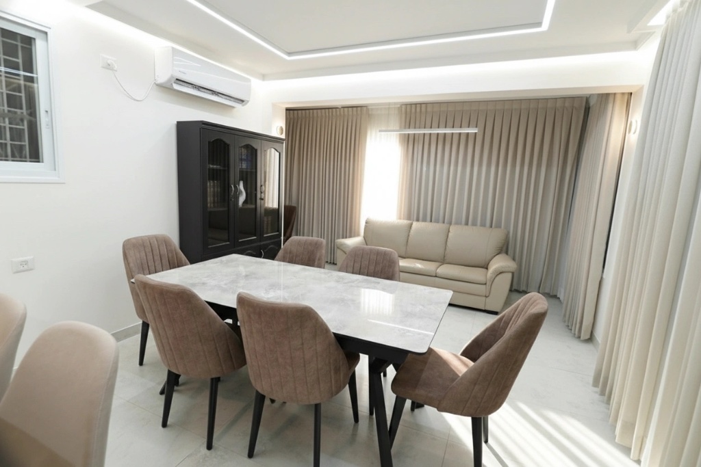A bright dining and living area in one of the apartments